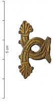IND-9024 - Objet à identifierbronze doréOrnement plat, comportant deux brins cannelés emmêlés, terminés par des palmettes.