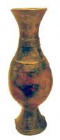 CRU-5001 - Cruche de type coptebronzeCruche à profil sinusoïdal, anse légèrement surélevée et surmontée d'un poucier foliacé ; pied évasé et tronconique, creux par dessous.