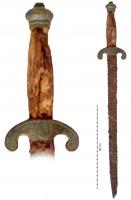 DAG-9010 - Daguefer, bronzeDague en fer, poignée de bois limitée par une garde en forme de pelte, et un bouton moulurée en guise de pommeau.