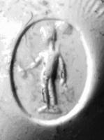 INT-4061 - Intaille : personnage à déterminerpierrePersonnage indéterminé debout à g., tenant deux attributs.