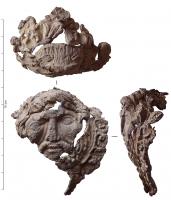 IND-7009 - Reliquaire ? Embout de...?plombExtrémité creuse d'un objet figurant la tête du Christ dans une couronne fleurie, sous la forme d'un visage barbu, émacié.