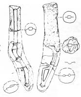 MOU-4002 - Moule : fibuleterre cuiteMoule en argile pour la coulée de fibules de type 