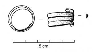 HEL-3001 - HelixbronzeSpirale filiforme, constituée de plusieurs tours superposés d'un fil mince, de section ronde ou triangulaire ; diamètre de l'ordre de 15 à 20mm ; décor d'incisions en chevrons aux extrémités.