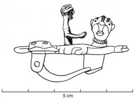 FIB-4624 - Fibule zoomorphe, groupe : homme sur panthèrebronzeUn homme, le corps coupé au niveau du bassin, émerge d'une panthère à tête humaine.
