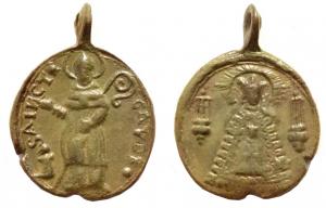MER-9015 - Médaille religieuse : saint GaudbronzeMédaille à bélière coulée, perpendiculaire au plan de la médaille ; Av/ le saint en év^que, tenant la crosse, autour SANCTI / GAVDI ; Rv/ Vierge habillée, lanternes de procession.