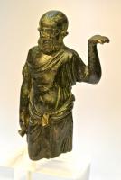 STE-4478 - Statuette : SilènebronzeTPQ : -30 - TAQ : 300Silène sous la forme d'un homme âgé, chauve et bedonnant, vêtu d'une tunique nouée à la taille, porte sur sa main gauche, dont la paume est relevée vers le haut un plateau ou un panier.