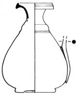 BLS-4010 - Balsamaire de type Tassinari F.2340bronzeBalsamaire à corps ovoïde et profil sinusoïdal, lèvre oblique épaissie ; petite anse fixée par brasure sir le col et la panse ; fond en retrait avec cercles concentriques.