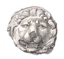 PHA-4023 - Phalère : tête de lionbronze, plomb, argentPhalère à décor figuré : tête de lion, encadrée d'une abondante crinière.