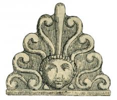 ANT-4004 - Antéfixe : Palmette à 7 branches sur esses et rêteterre cuiteAntéfixe moulée, en forme de palmette à 9 lobes, émergeant d'une tête humaine juvénile (type sans estampille en façade).