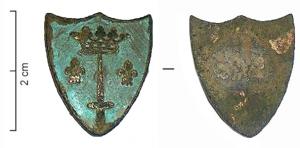 BTN-9042 - Insigne en forme d'écubronzeInsigne en forme d'écu à sommet festonné : dd'azur à deux fleurs de lis d'or, une épée la pointe en haut surmontée d'une couronne d'or.