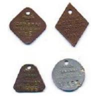 FIS-9004 - Plaque fiscale pour chien : CambraibronzePlaque losangique au sommet percé, avec une inscription moulée : VILLE DE SAINT-NAZAIRE / CHIENS 2E CRIE / 1934  et au-dessus de la date, un numéro estampé.