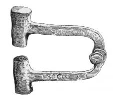 CMN-4006 - Coins monétaires articulésferPaire de coins articulés, constitués de robustes masses cylindriques, gravées pour former les coins d'avers et de revers, prolongées par des tiges plates et recourbées pour s'articuler avec un rivet axial.