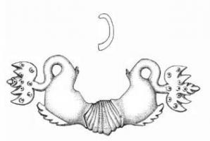 PGM-4001 - Poignée de meuble, dauphinsbronzePoignée de meuble en relief plat, constituée de deux dauphins affrontés de part et d'autre d'un disque ou d'un coquillage. Les queues sinusoïdales se terminent par des nageoires en forme de feuilles. Plusieurs variantes dans le traitement des animaux et des attaches.