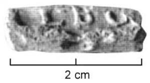 TES-4055 - Tessère rectangulaire : L.BCplombPlaquette en plomb, découpée au tranchet, écrasée par l'apposition d'une marque estampée sur une face, sans cartouche : L.BC ;  revers  lisse.