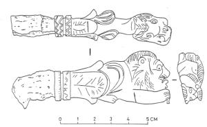 CLE-4072 - Clé : lion émergeant d'un fleuronbronze, ferClé en fer à manche coulé en bronze, en forme de lion couché, la tête posée entre les pattes antérieures, le corps entier pouvant émerger d'un fleuron.
