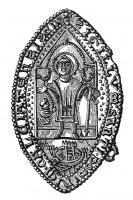 ESP-7057 - Enseigne de pèlerinage : saint Dominique de la ChausséeplombEnseigne de pèlerinage en remploi d'un sceau aux causes (?) de type hagiographique. Forme en navette. Dans le champ, saint Dominique en pied, nimbé, tenant un bâton pastoral et accompagné des formes du miracle du pendu-dépendu, coq et poule perchés chacun sur un avant-bras, l'orant, aux pieds, à droite, les mains jointes par un lien à celle du saint; la figure dans une niche gothique à  arcature ornée semi-circulaire ; en piedouche, une forme topographique (église/cité fortifiée) ; le champ semé de points, de part et d'autre de la niche ; la légende, à l'exergue, entre deux filets gènetés.
Legende (lettres majuscules) + S(contournée)IGILLVM : SANTI . DOMINICI . CALCIATENS(contournée)IS(contournée) (ad) C(aus)AS(contournée) (?)
Trace de deux anneaux de fixation sur le bord droit de l'objet.