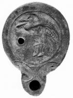 LMP-4123 - Lampe Loeschcke IV syro-palestinienne : Eros musicienterre cuiteLampe à bec à volutes. Médaillon décoré d'un Eros jouant d'un double aulos, à gauche.
