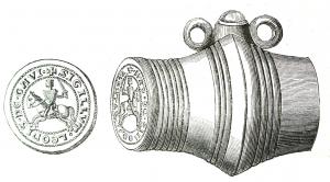 SIG-7006 - Sceau-matriceargentSceau-matrice en forme de baril, pouvant être suspendu à l'aide de deux anneaux; une extrémité porte le sceau, l'autre devait contenir le contre-sceau.